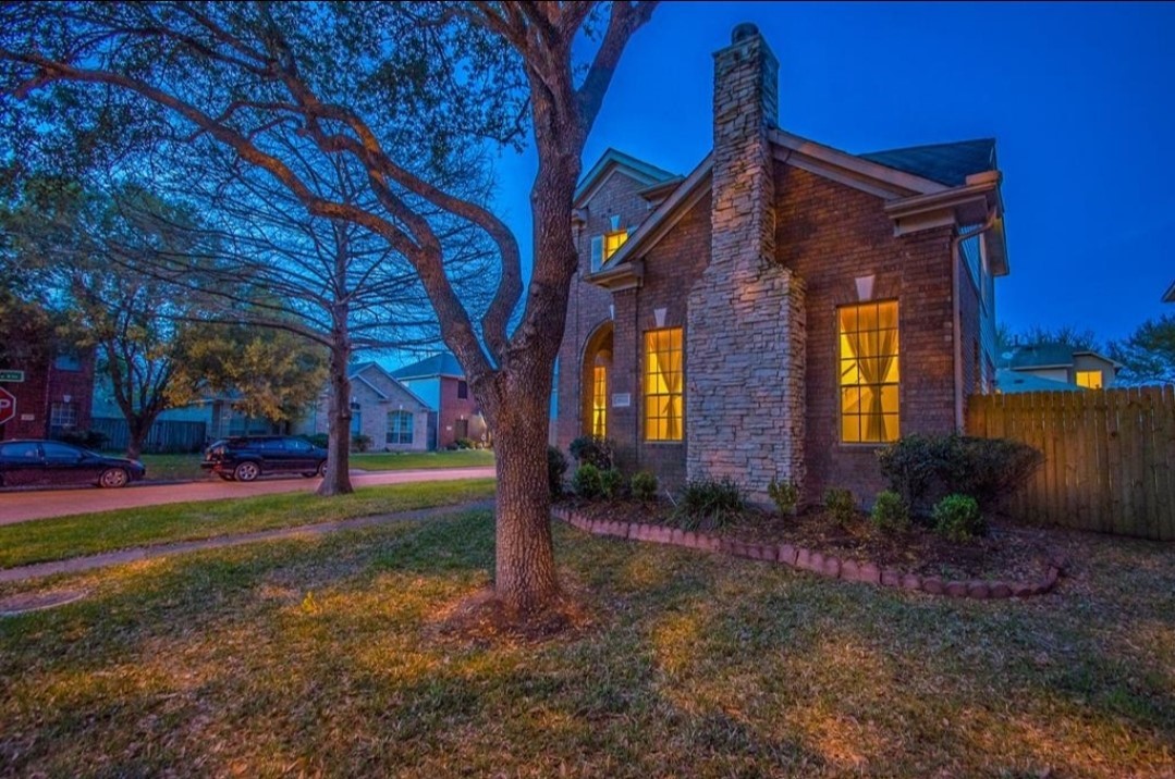 15903 Timber Chase Drive Houston, TX 77082 - Photo 2 of 20 a brick building with a yard