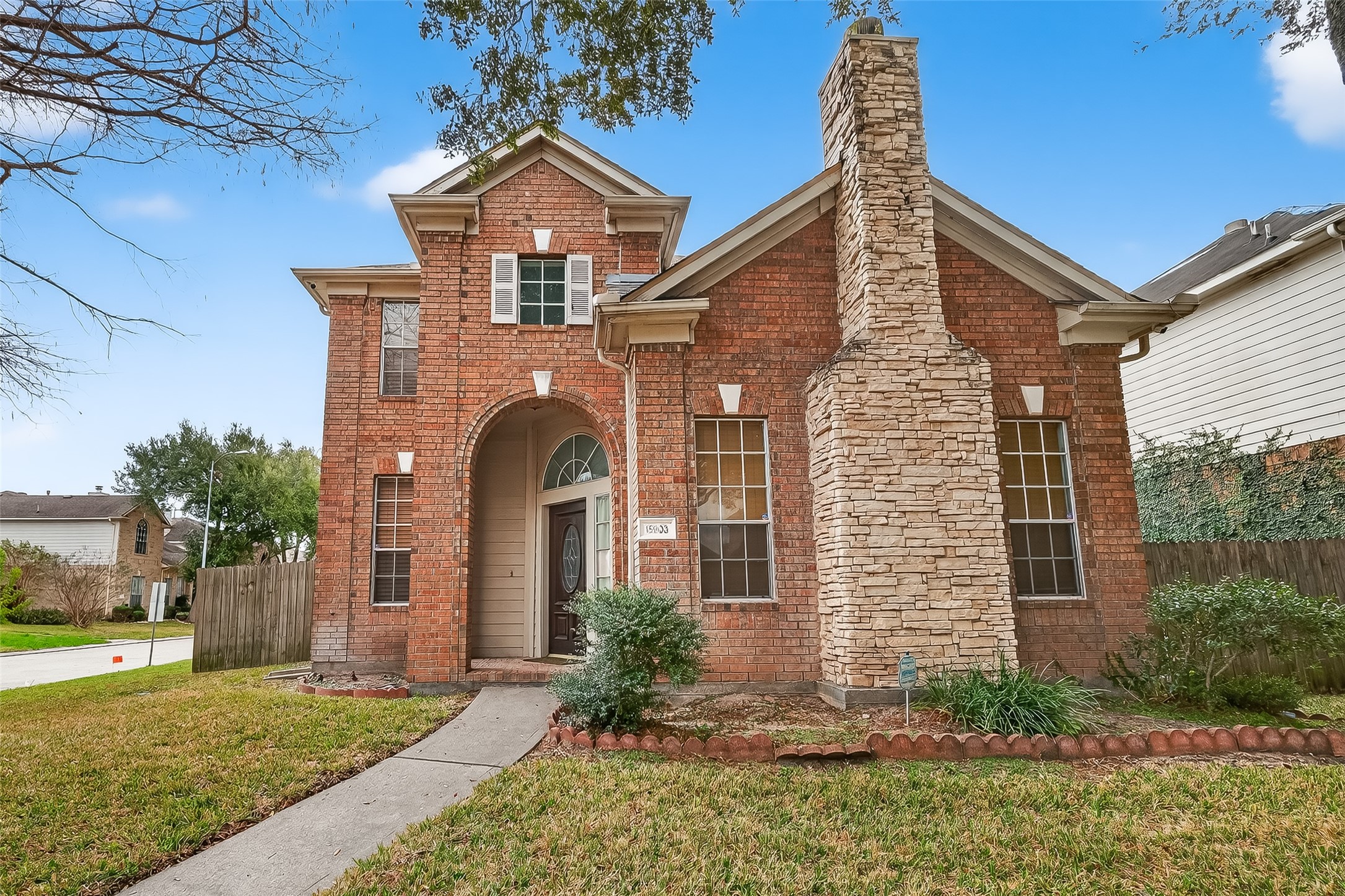 15903 Timber Chase Drive Houston, TX 77082 - Photo 3 of 20 a front view of a house with garden