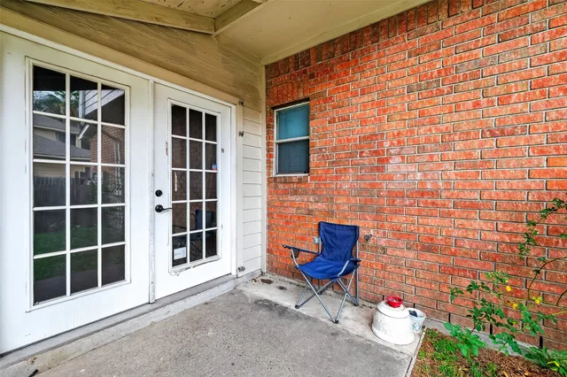 a backyard of a house with outdoor seating