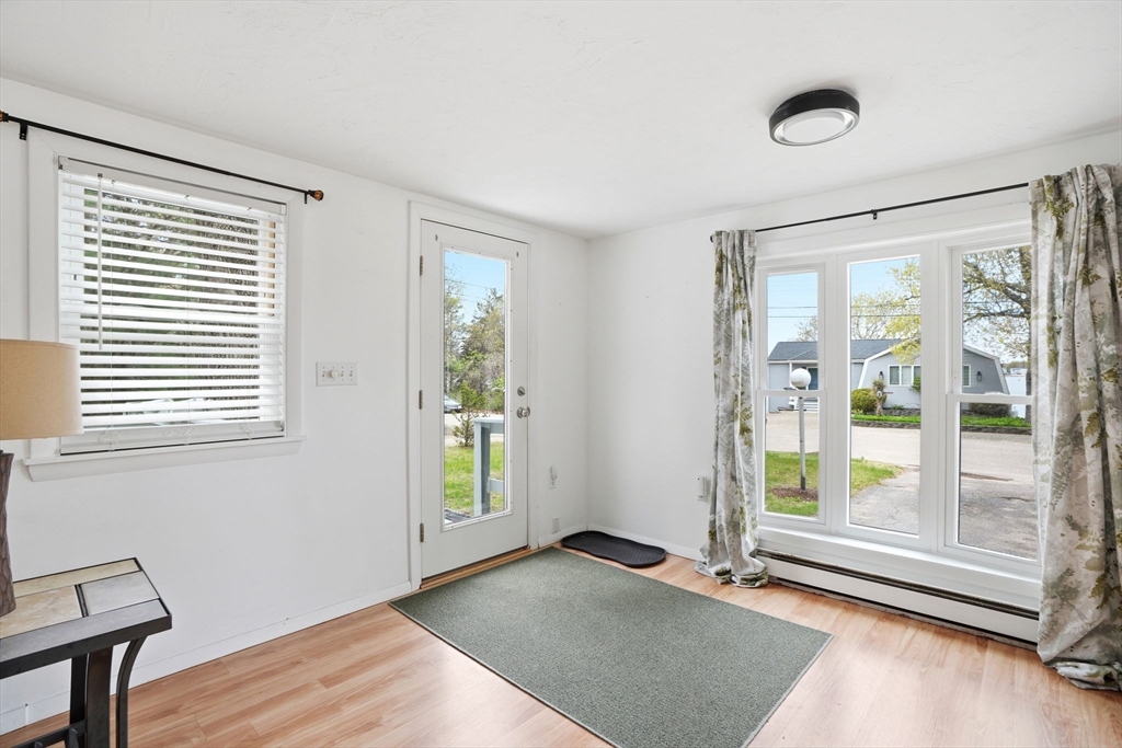 94 Edgewater Drive Wareham, MA 02571 - Photo 16 of 37 a view of an empty room with a window and wooden floor