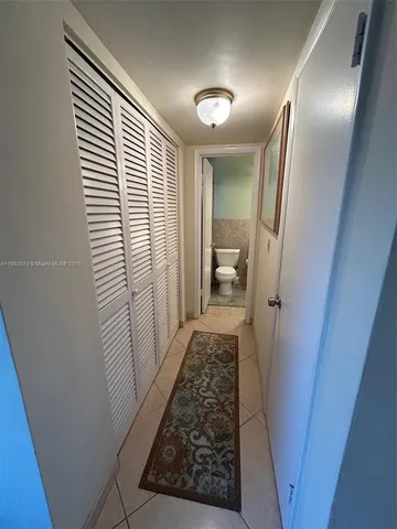 a kitchen with a sink a stove and refrigerator