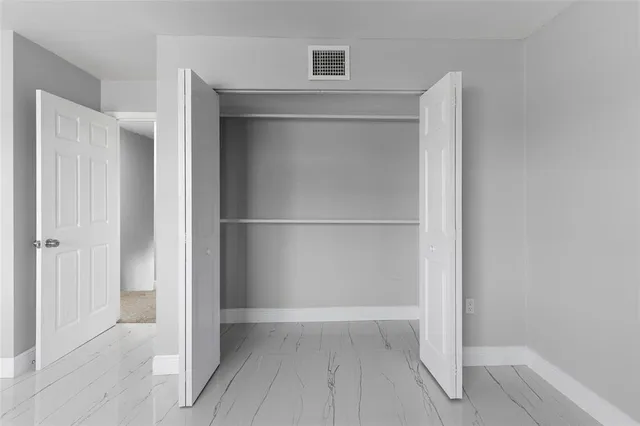 a bathroom with a toilet and shower