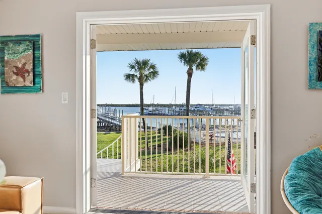 a bedroom with a bed chair and a window