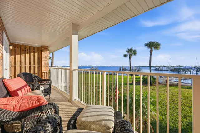 a view of a balcony with furniture
