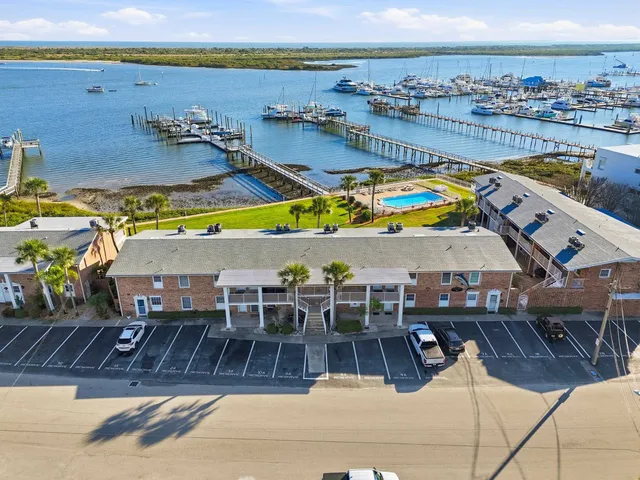 a view of a lake with a table and chairs