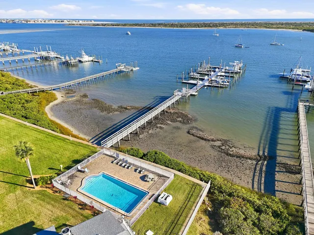an aerial view of a house with a swimming pool yard and outdoor seating