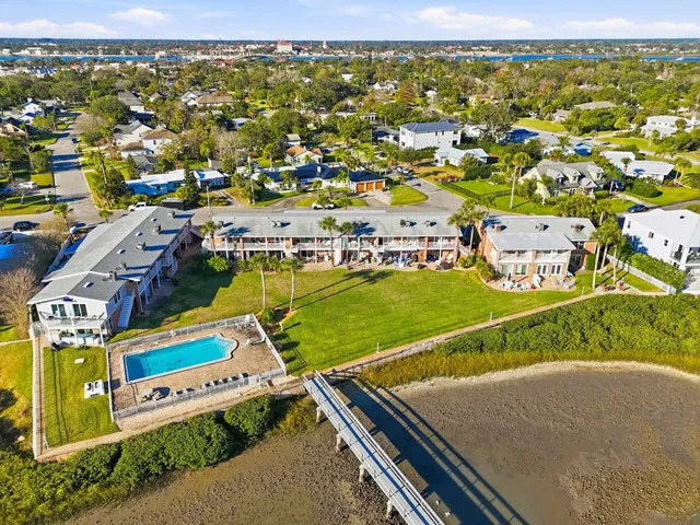 an aerial view of a house with a lake view