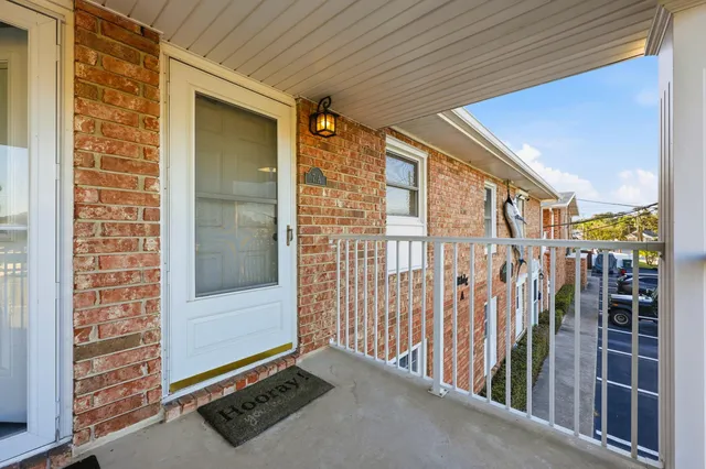 a kitchen with stainless steel appliances granite countertop a dining table chairs and granite counter tops