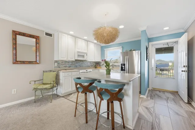 a kitchen with cabinets a sink and appliances