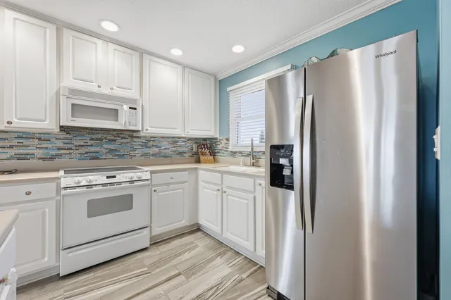 a bathroom with a double vanity sink and mirror
