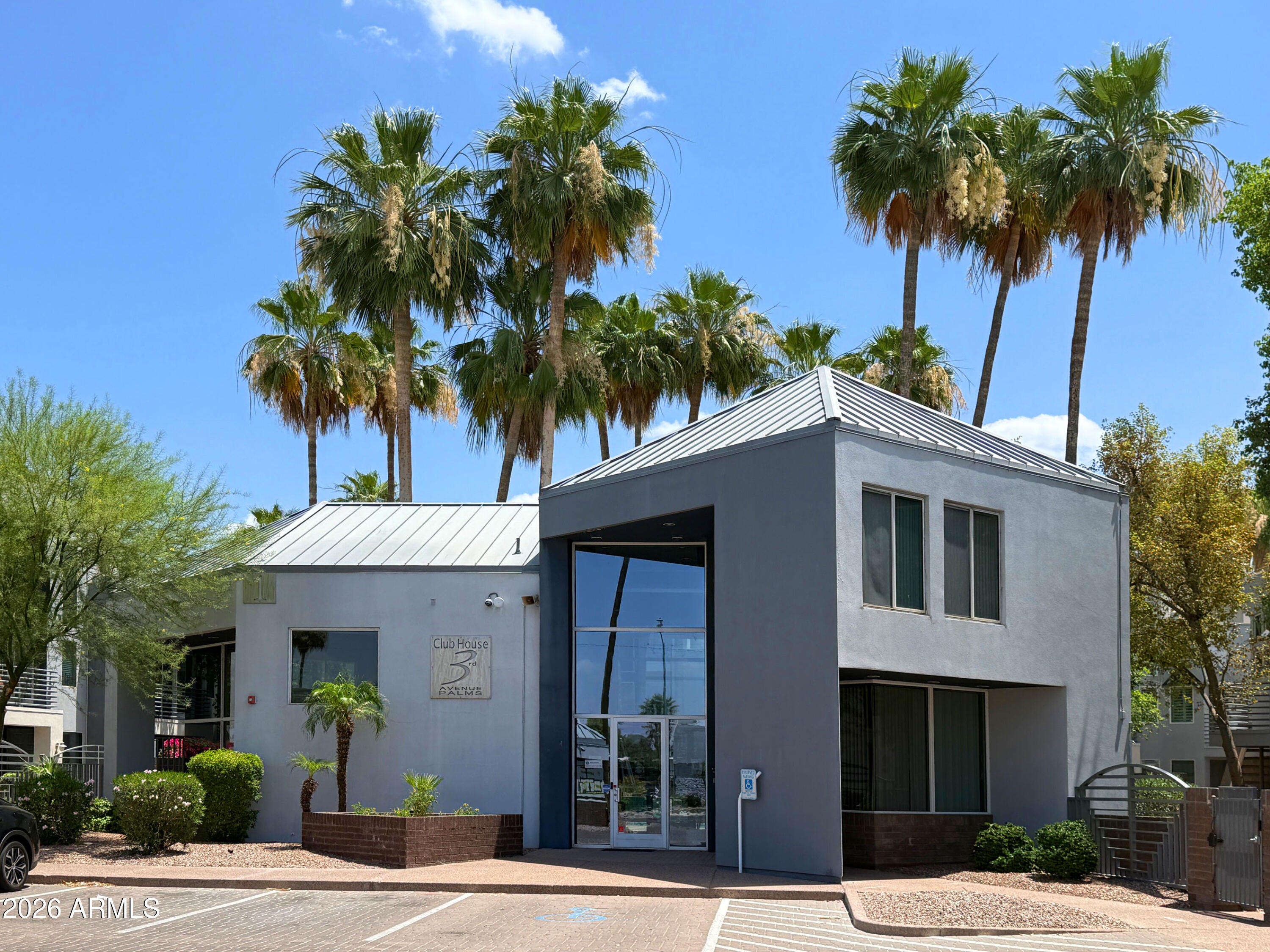 3633 North 3rd Avenue, Unit 1027 Phoenix, AZ 85013 - Photo 20 of 29 a front view of a house with a tree