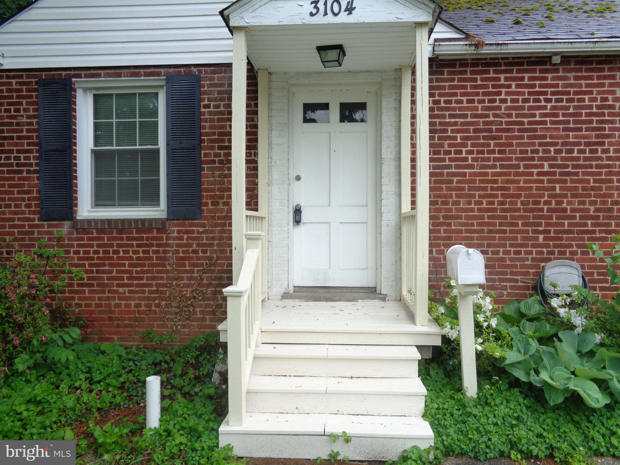 3104 Parker Avenue Silver Spring, MD 20902 - Photo 17 of 32 a front view of a house with outdoor seating and yard