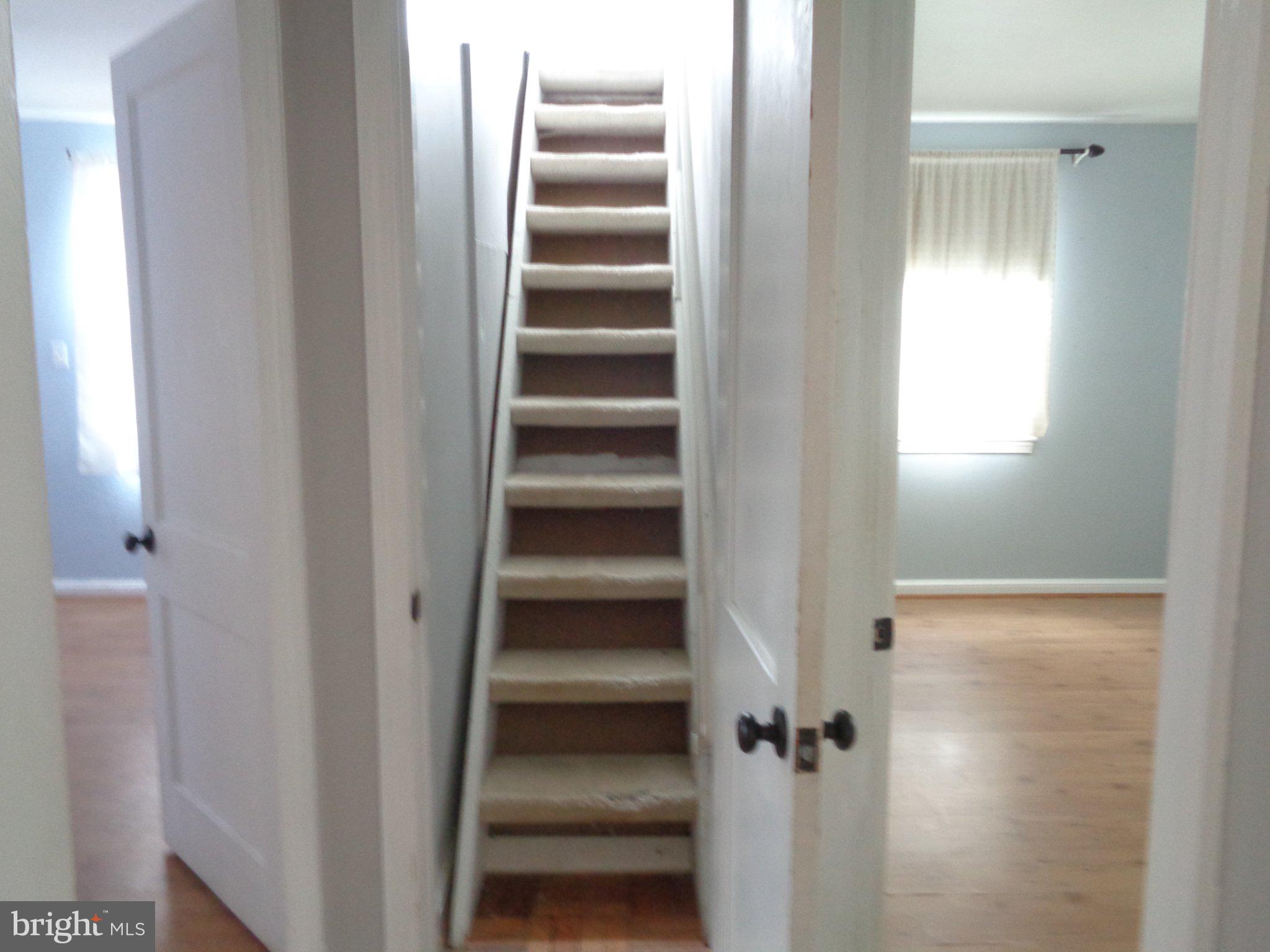 3104 Parker Avenue Silver Spring, MD 20902 - Photo 20 of 32 a view of a hallway with wooden cabinets