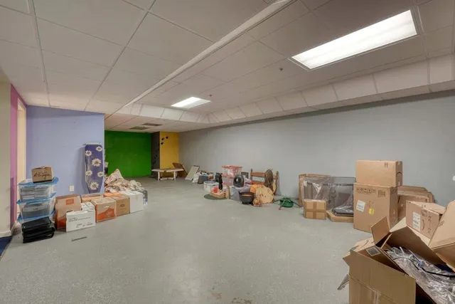 a front view of house with yard and garage