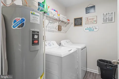 a utility room with fridge and