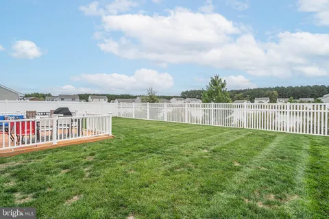 a view of a yard with a lake view
