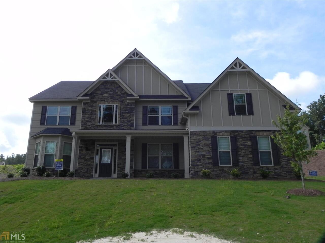 2958 Bud Rutledge Drive, Unit 106 Snellville, GA 30039 - Photo 1 of 1 front view of a house with a yard