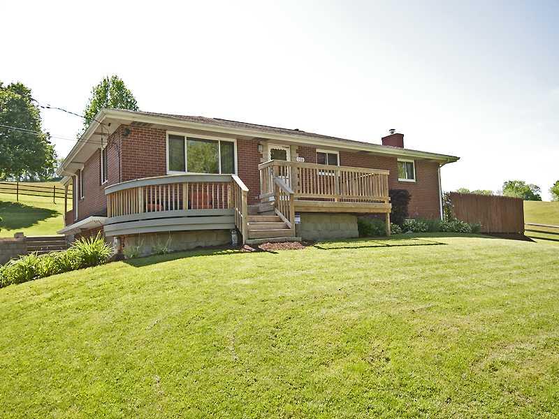 Exterior Front. Front Porch Offers Views of Custom Designed Versa Lock Walls & Beautiful Landscaped Grounds.