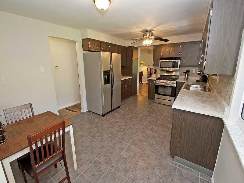 Kitchen. Spacious Eat-in -Kitchen with New Vangura Counter Tops & Tile Floors.