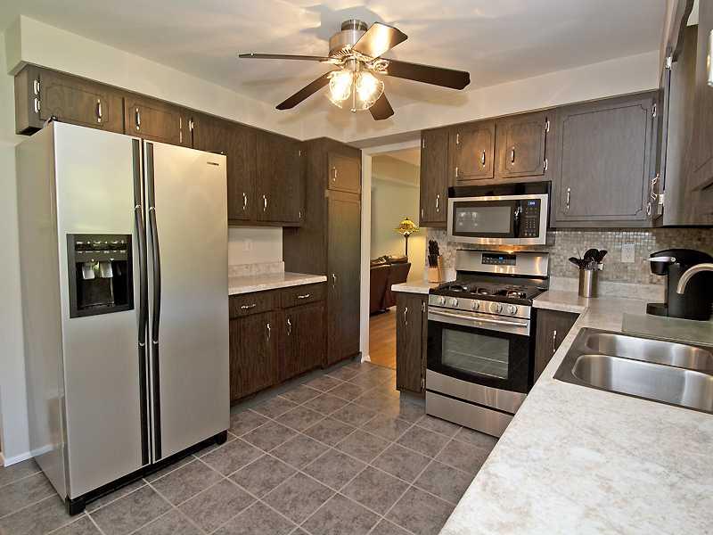 Kitchen. Kitchen has 2 Doorways; One Leading to Dining Room & The Other Into The Hallway.  
