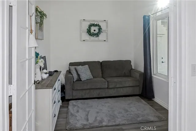 a living room with furniture and a gate