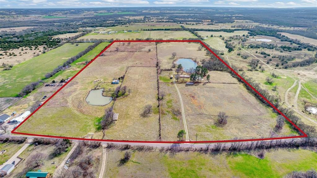 15694 County Road 834 Blue Ridge, TX 75424 - Photo 1 of 14 an aerial view of a swimming pool with a yard