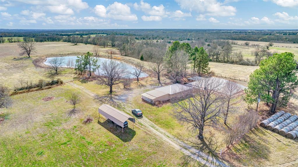 15694 County Road 834 Blue Ridge, TX 75424 - Photo 4 of 14 a view of a lake with couches in patio