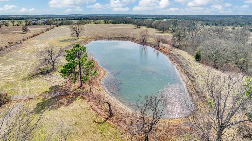 15694 County Road 834 Blue Ridge, TX 75424 - Photo 6 of 14 a view of a lake with a mountain in the background