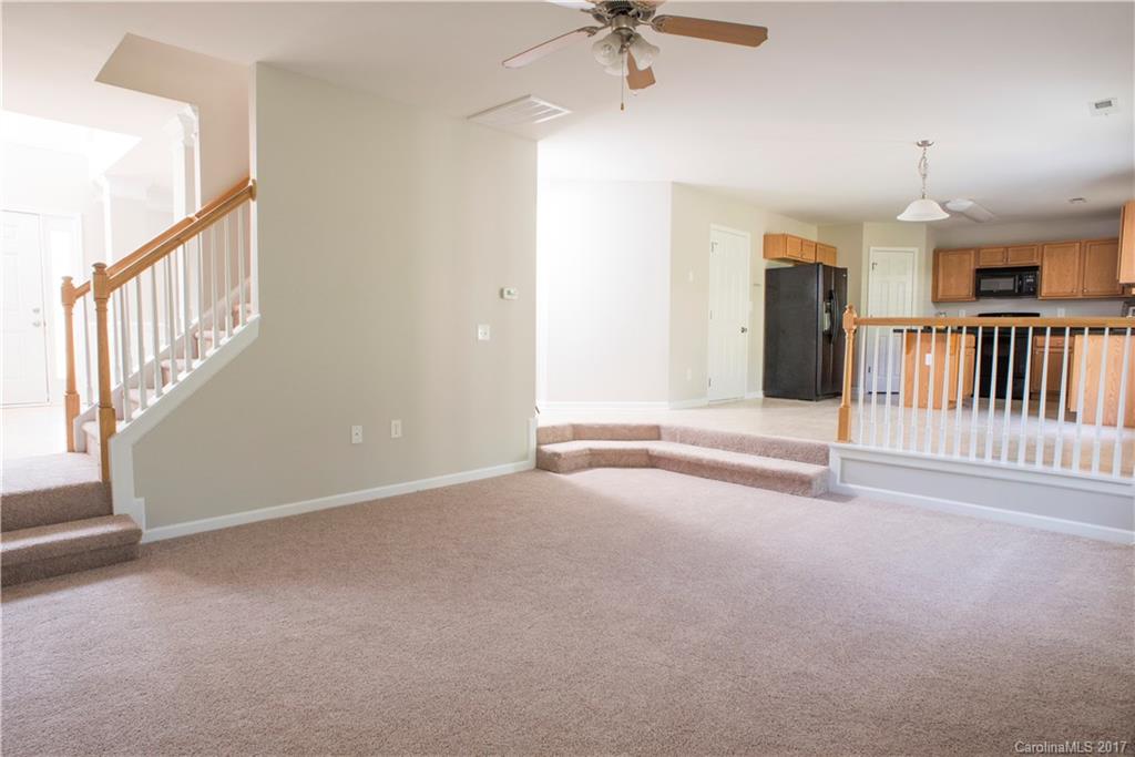 5207 Sunriver Road, Unit 52 Gastonia, NC 28054 - Photo 15 of 24 a view of an empty room with a fireplace