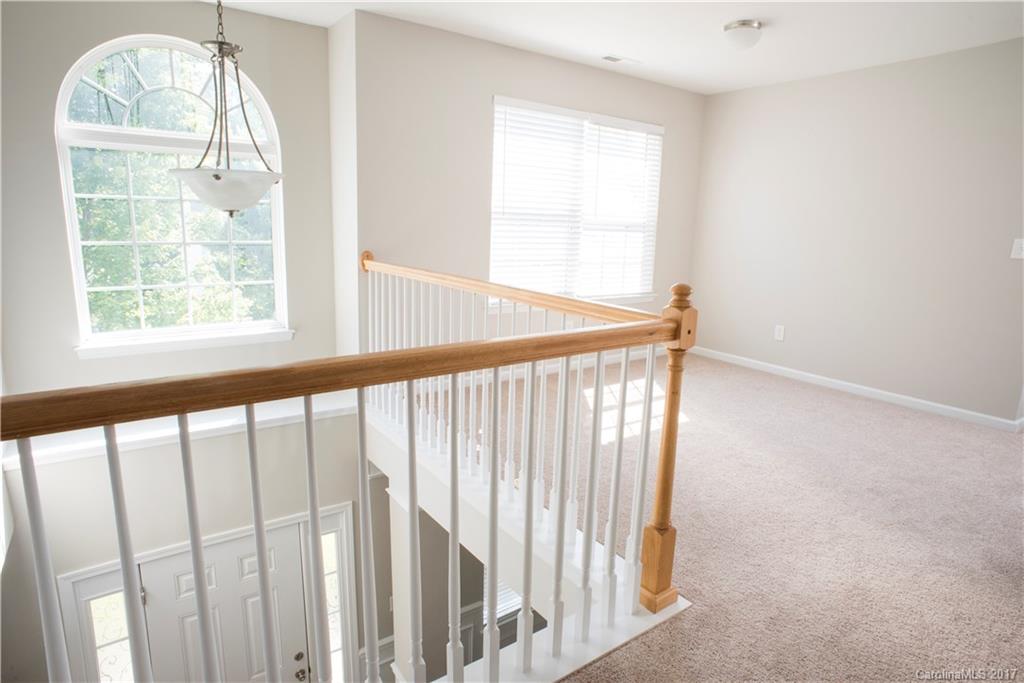 5207 Sunriver Road, Unit 52 Gastonia, NC 28054 - Photo 16 of 24 a view of porch with wooden floor and a window