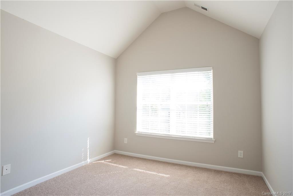 5207 Sunriver Road, Unit 52 Gastonia, NC 28054 - Photo 20 of 24 an empty room with a window