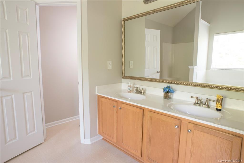 5207 Sunriver Road, Unit 52 Gastonia, NC 28054 - Photo 23 of 24 a bathroom with a sink and a mirror