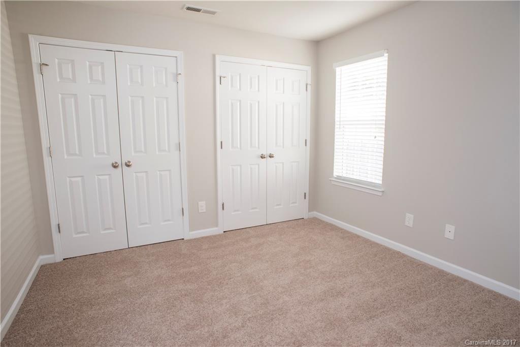5207 Sunriver Road, Unit 52 Gastonia, NC 28054 - Photo 9 of 24 an empty room with windows
