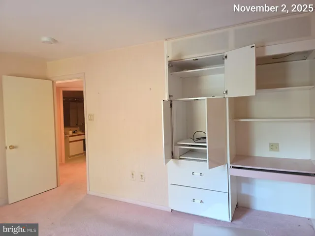 a room with a bed and a large window