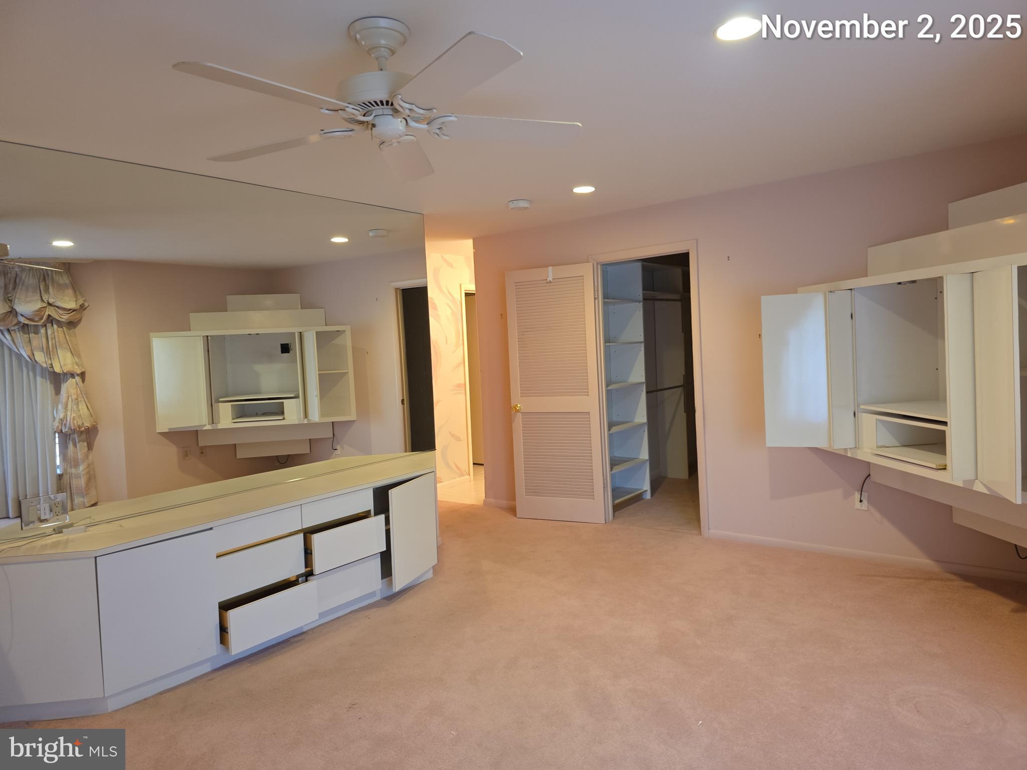 3031 Fallstaff Road, Unit 306C Baltimore, MD 21209 - Photo 18 of 23 a view of an empty room with window and cabinet