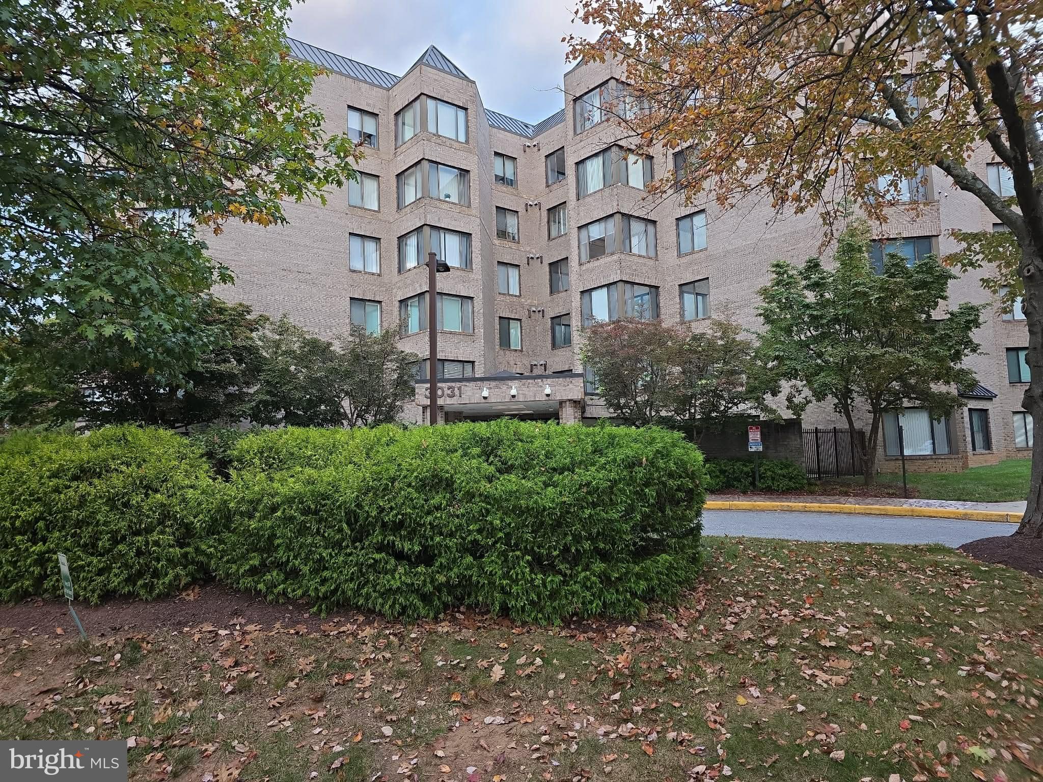 3031 Fallstaff Road, Unit 306C Baltimore, MD 21209 - Photo 2 of 23 a view of a building with a garden