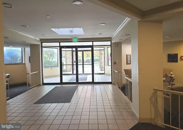 a bedroom with a bed and painting on the wall