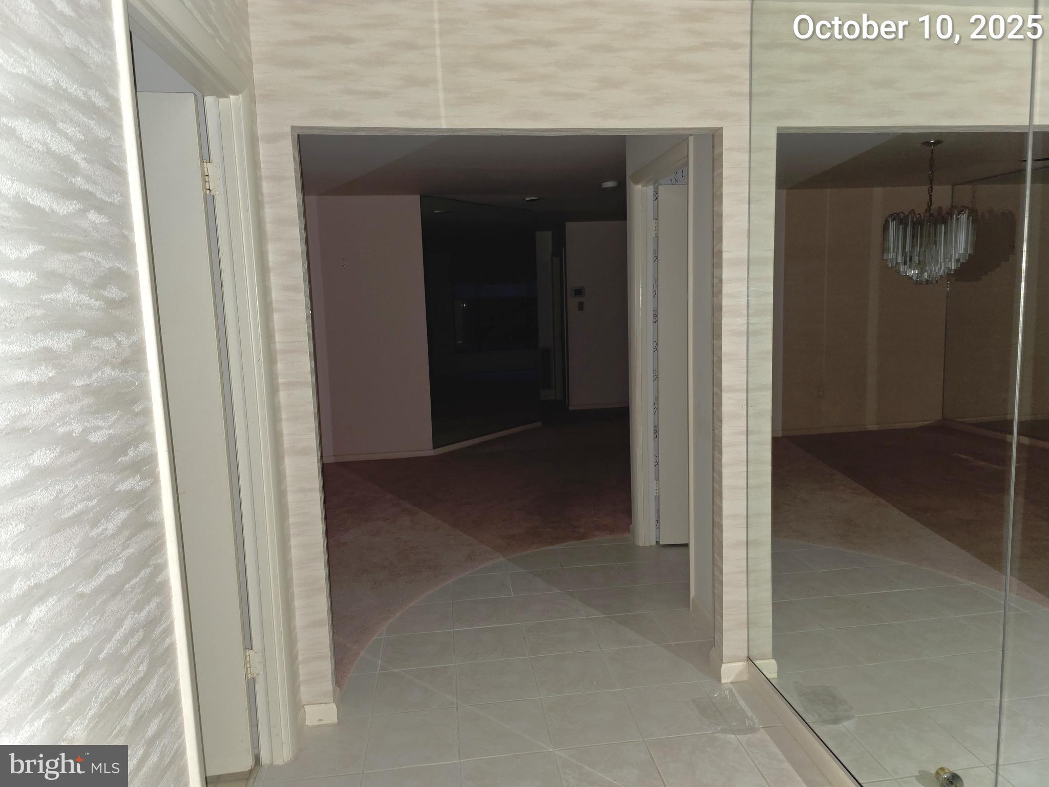 3031 Fallstaff Road, Unit 306C Baltimore, MD 21209 - Photo 7 of 23 a view of a hallway with a glass door