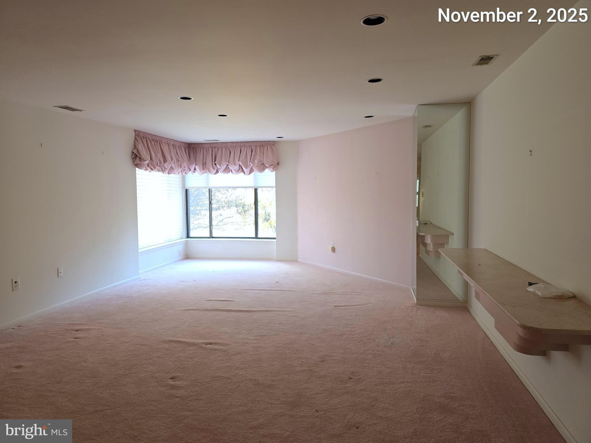 3031 Fallstaff Road, Unit 306C Baltimore, MD 21209 - Photo 8 of 23 a view of an empty room with a window