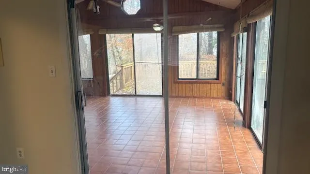 a view of interior space with wooden floor and windows