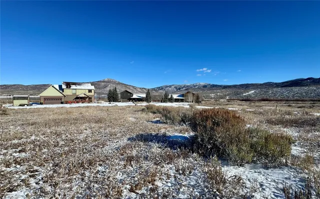 a view of street with a car park side of the road