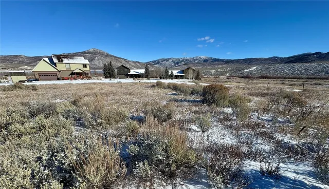 a view of a town with big trees