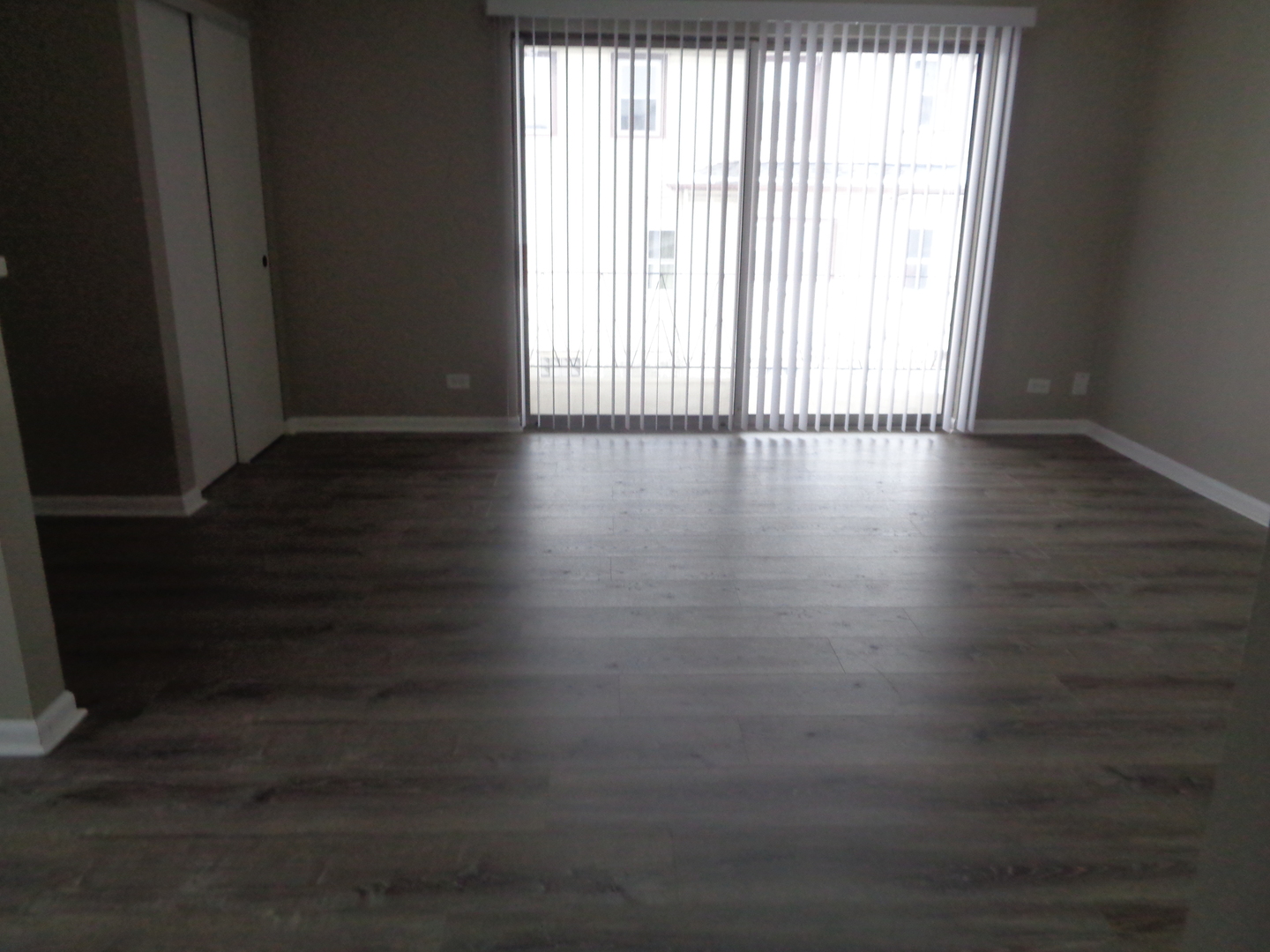 9644 South Kedzie Avenue, Unit 2 Evergreen Park, IL 60805 - Photo 3 of 8 a view of a livingroom with wooden floor and a window