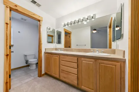a bathroom with a shower and toilet