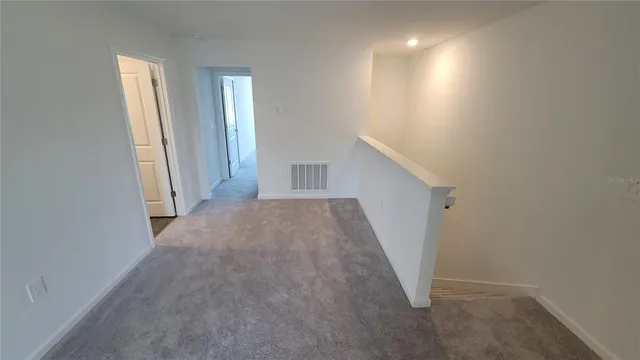 a view of hallway with closet
