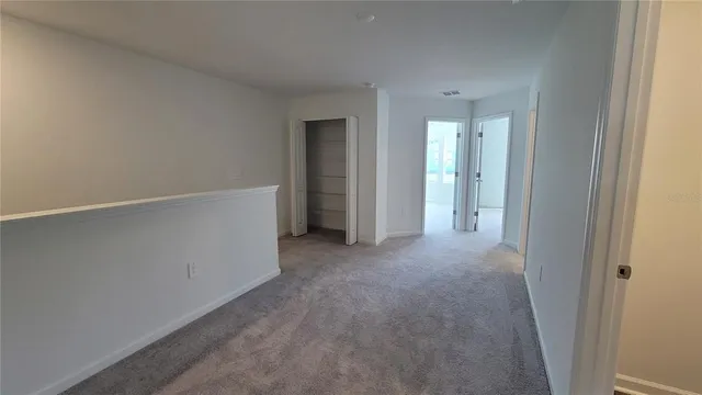 a view of a bathroom with a toilet and a shower