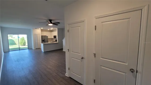a view of a livingroom with furniture wooden floor and window