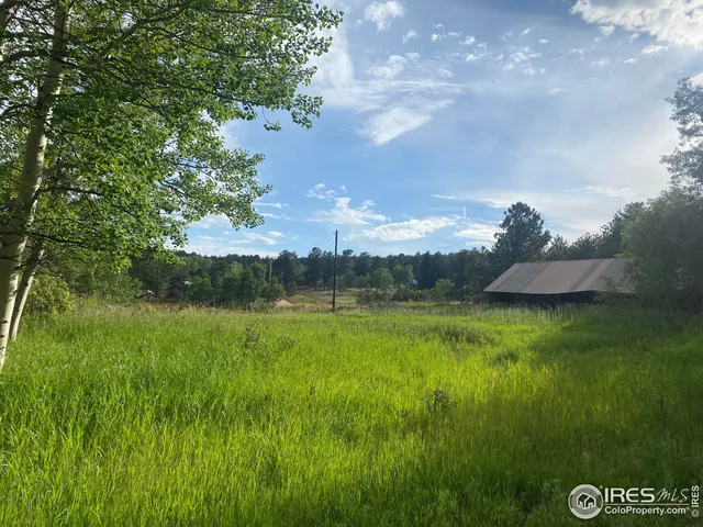 a view of a golf course with a lake
