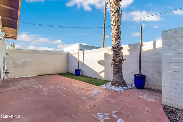 a view of a backyard with a garage