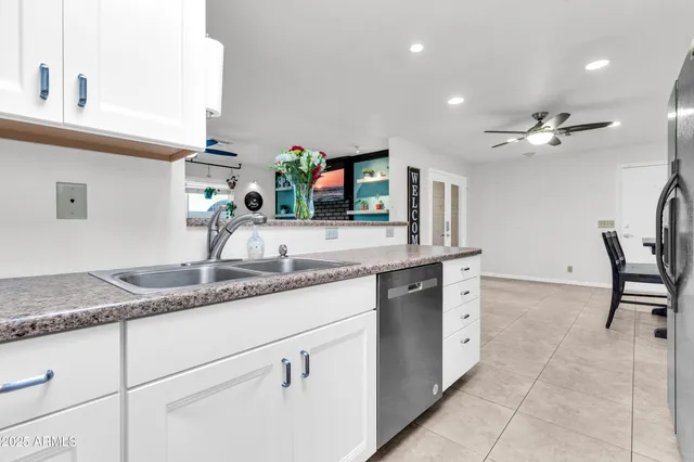 a couple of cars parked in front of a house